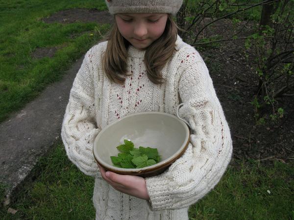 AJ with bowl of tea leaves