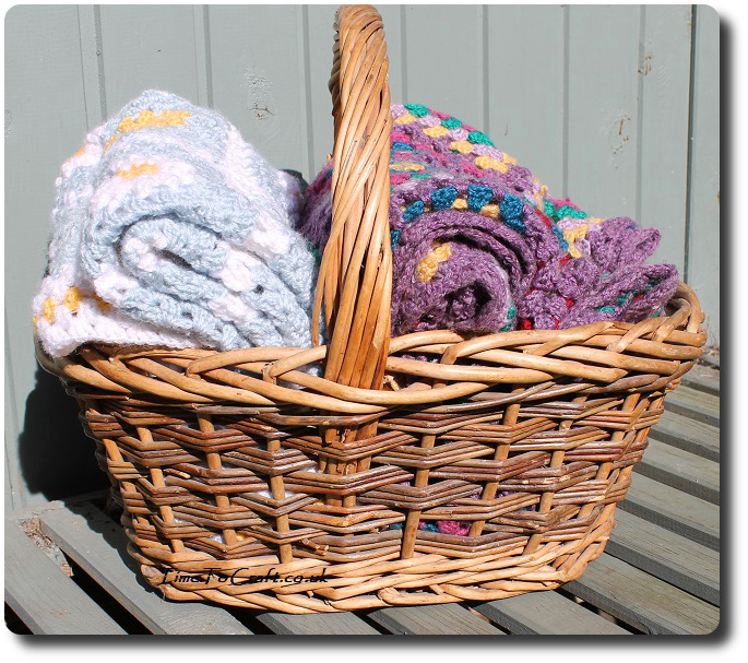 crochet daisy granny square blanket blue in basket