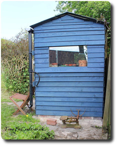 side of handmade potting shed