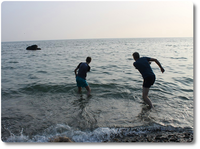 Father and son skimming stones.