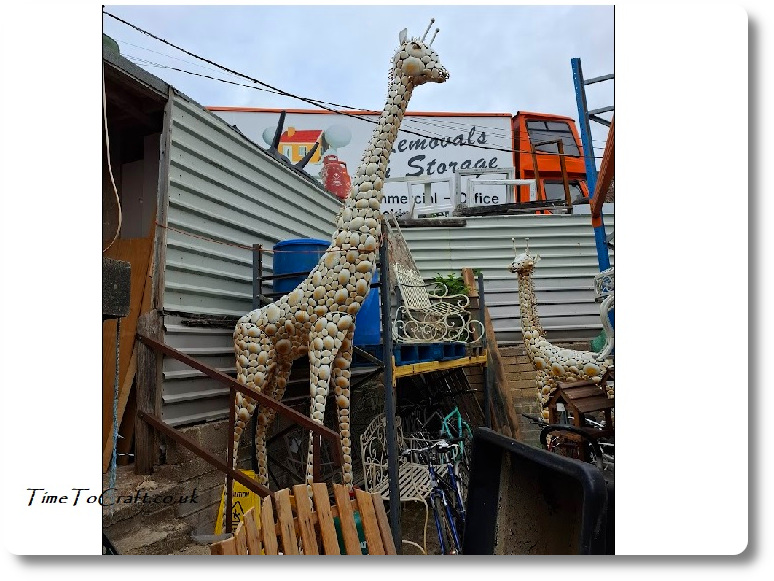 Metal giraffe in reclamation yard